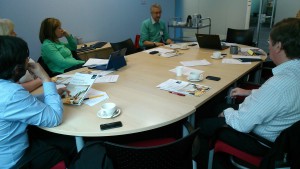 Meeting of the Qualifications Development team around a board table at SQA
