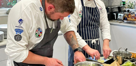 Simon Perkins prepares food with the Scottish Culinary Team