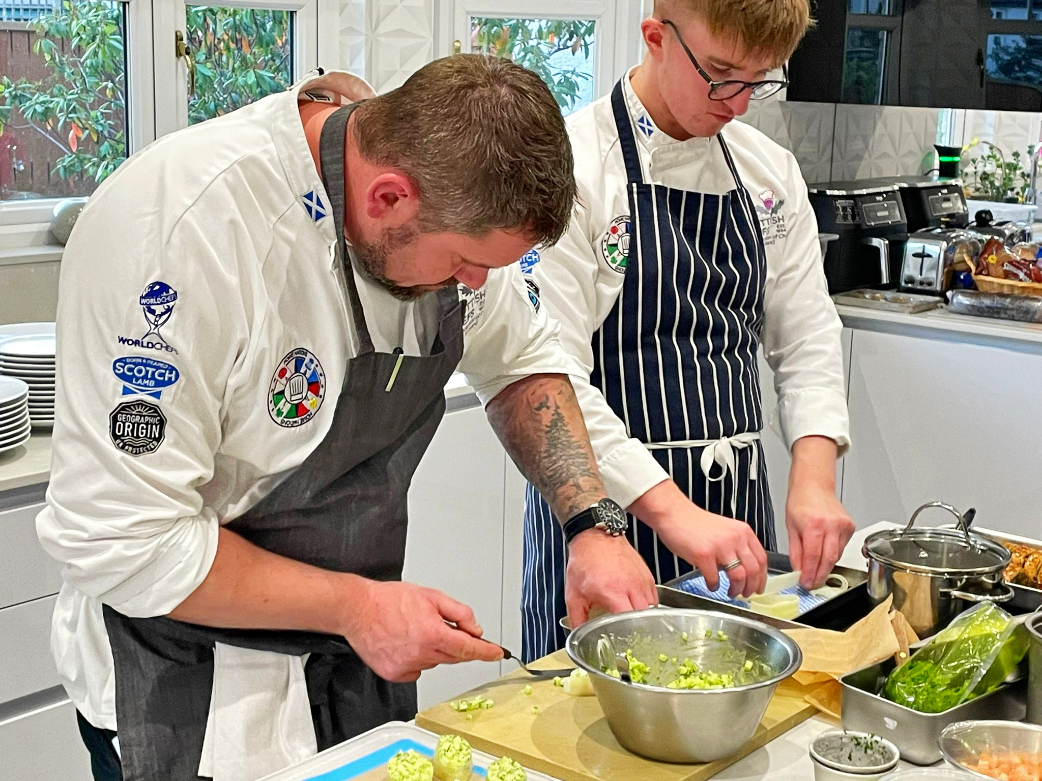 Simon Perkins prepares food with the Scottish Culinary Team