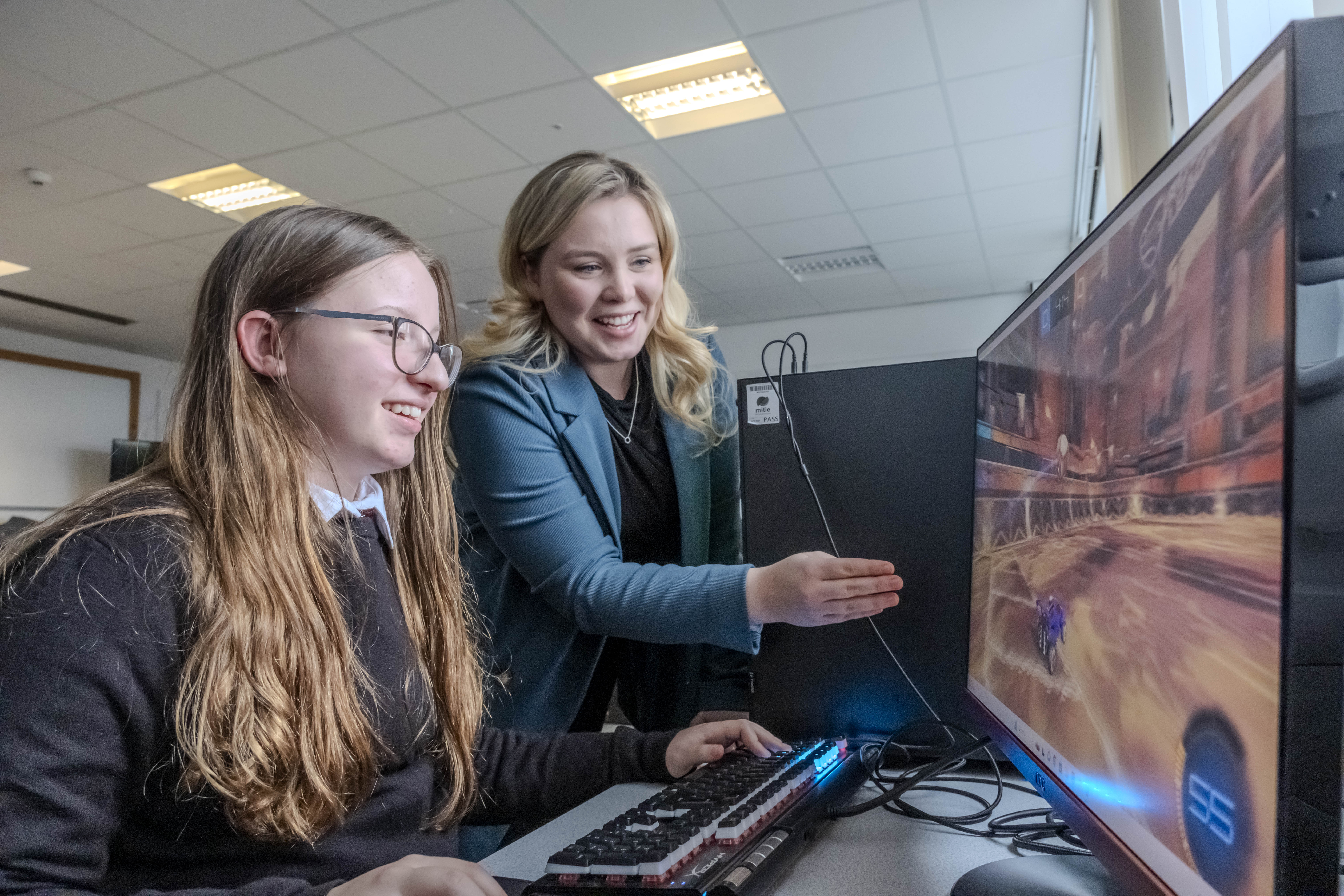 Teacher, Claire Litster, with a pupil from Dunoon Grammar School, working in an esports class.