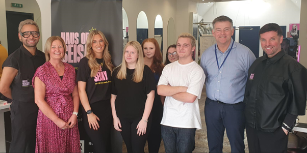 SQA staff with staff and learners from the Haus of Seisay hairdressing academy.