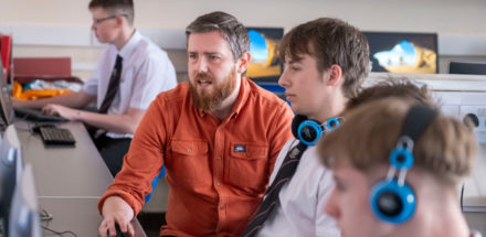 Pictured are Kingussie pupils, and Computing teacher Steve Bailey Young