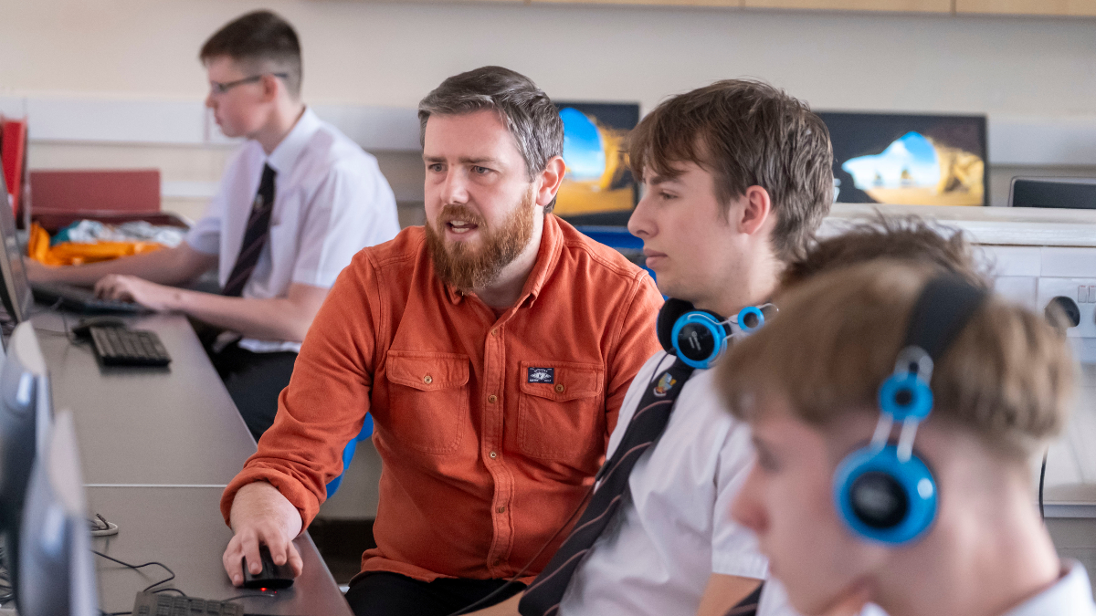 Pictured are Kingussie pupils, and Computing teacher Steve Bailey Young